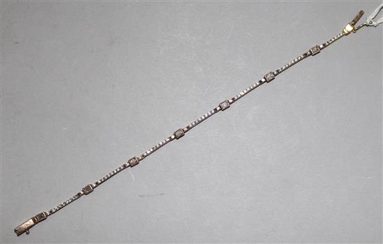 A gold and diamond articulated line bracelet, length 18.5cm